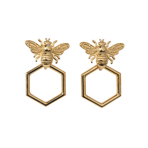 Goldbug Collection’s Beehive Hoop Earrings feature bee studs with forward-facing hexagon honeycomb hoop drops.