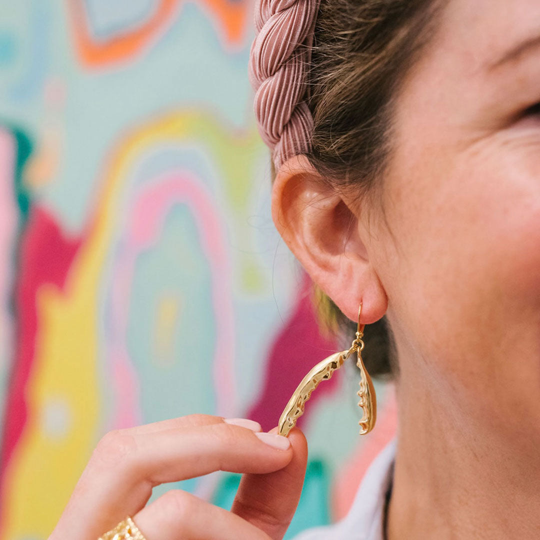 Goldbug Collection’s Crab Claw Drop Earrings feature swinging crab claw drops.  18K gold-plated  Leverbacks  Care: These bugs can't swim! For long life, please don't sleep, shower, or swim in your bugs.